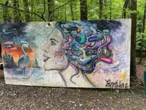 art work in the woods at The Heron Farm and Events Center